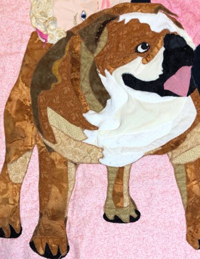 fabric pet portrait of brown and white dog being hugged by a girl