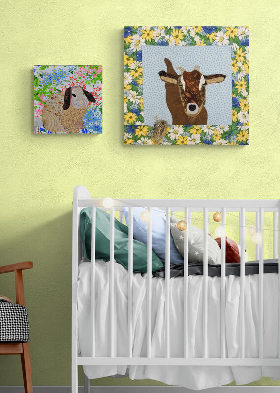 Wallhangings of bunny and goat on wall in nursery