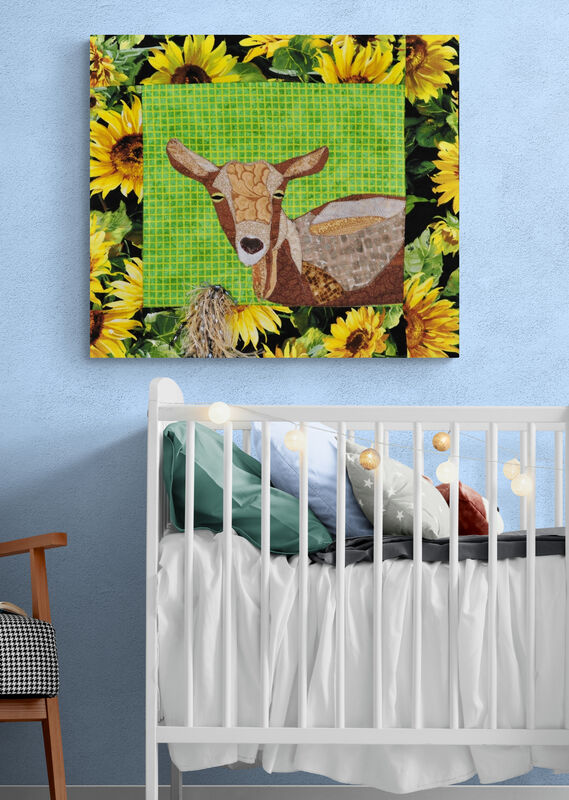 quilted wall hanging of a goat in nursery
