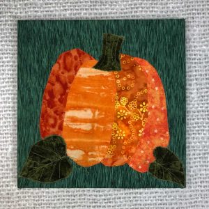 fabric pumpkin on canvas