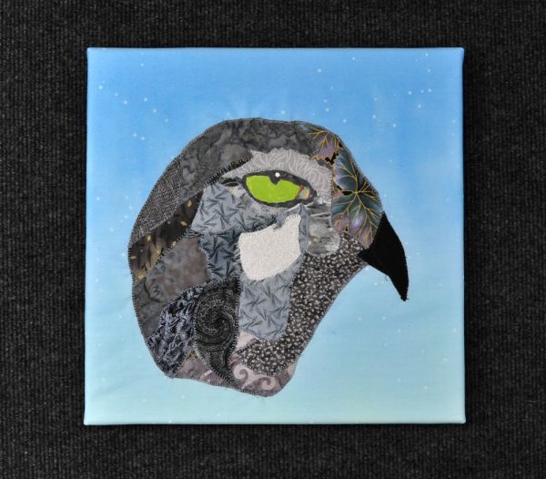 Head of grey hawk, Spirit Bird, on twilight sky