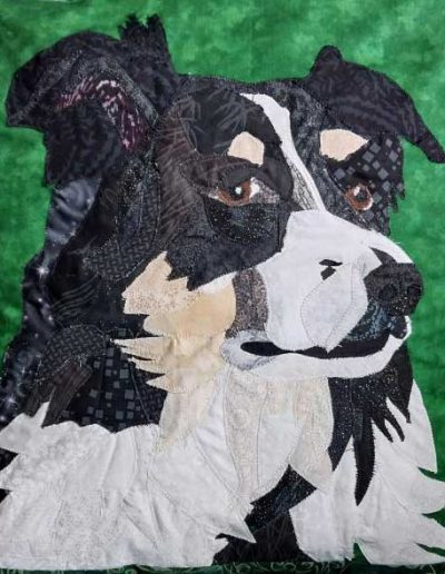 Fabric pet portait pillow of face of black and white dog